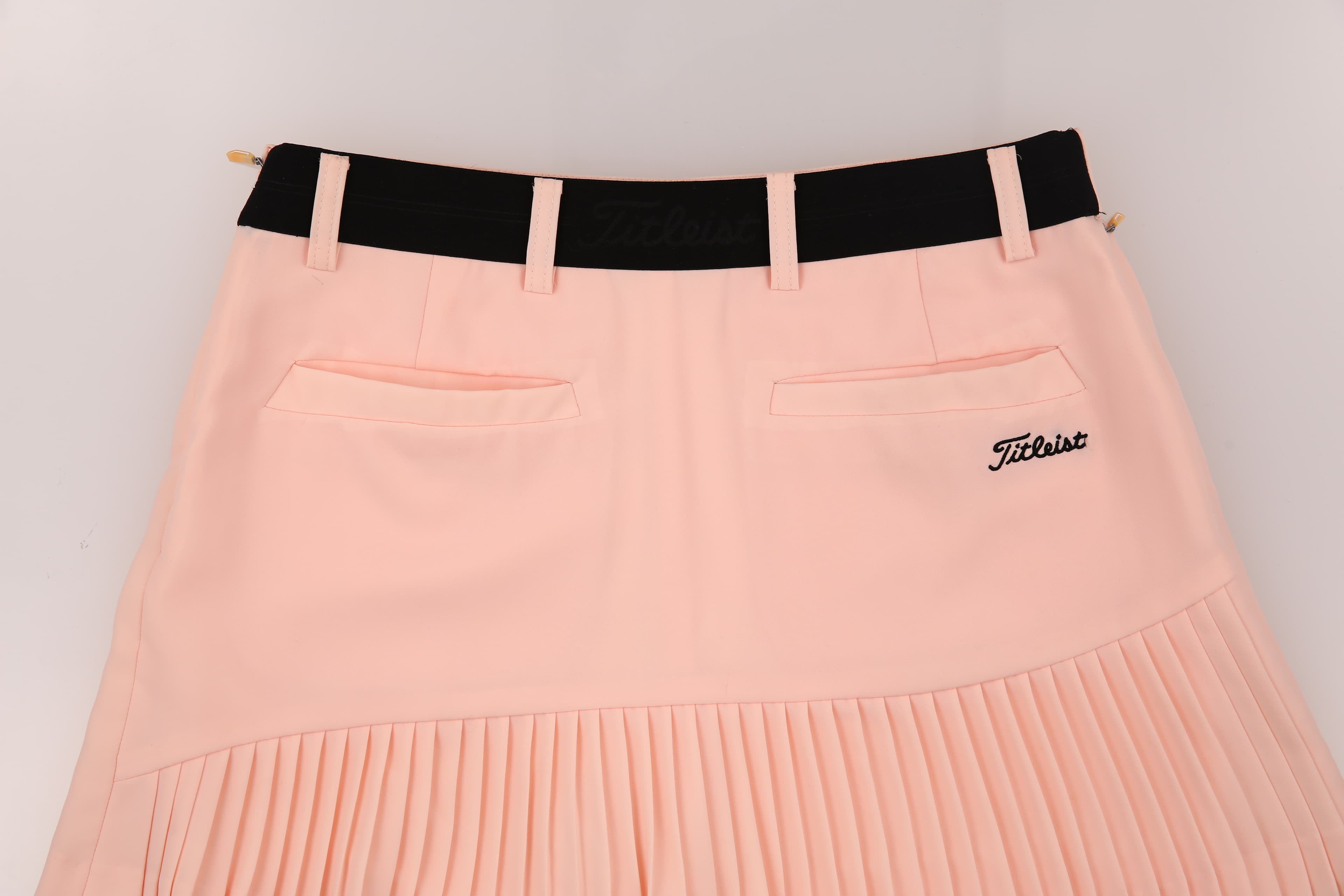 백 포켓 플리츠 스커트